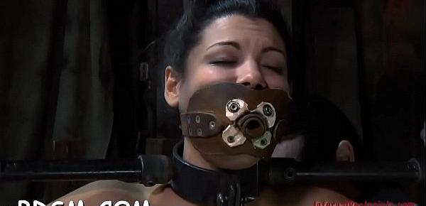  Gagged cutie is hoisted up before hard snatch prodding